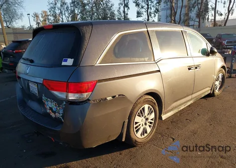 2014 Honda Odyssey Lx z USA, uszkodzony, nr VIN 5FNRL5H26EB047155